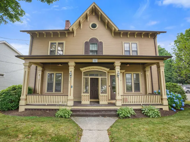 a front view of a house with garden