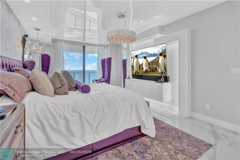 730 North Ocean Boulevard, Unit 503 Pompano Beach, FL 33062 - Photo 17 of 85 a bed room with a bed mirror and a night stand