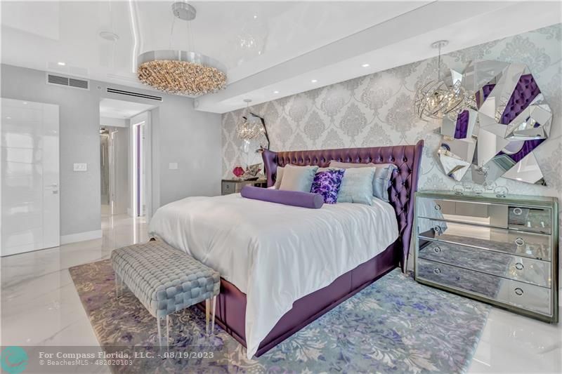 730 North Ocean Boulevard, Unit 503 Pompano Beach, FL 33062 - Photo 18 of 85 a bedroom with a bed and a painting on the wall