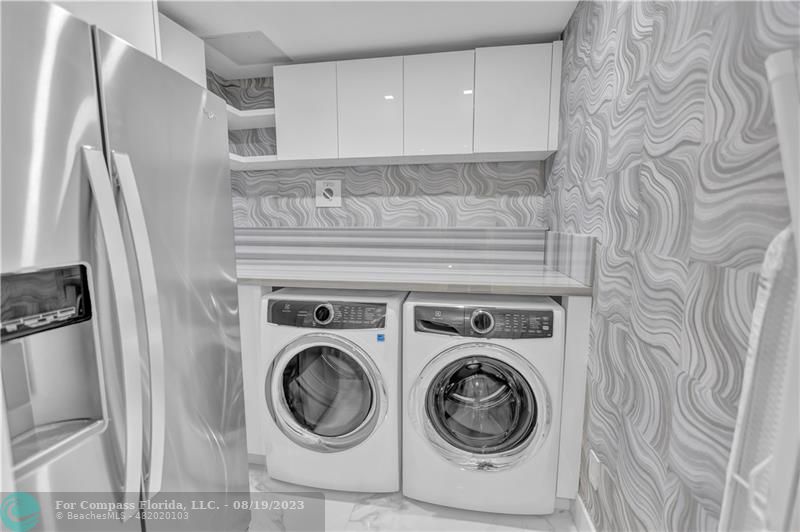 730 North Ocean Boulevard, Unit 503 Pompano Beach, FL 33062 - Photo 39 of 85 a utility room with dryer and washer
