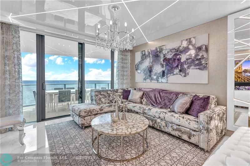 730 North Ocean Boulevard, Unit 503 Pompano Beach, FL 33062 - Photo 6 of 85 a living room with furniture and a large window