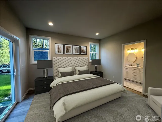 a bedroom with a large bed and a window