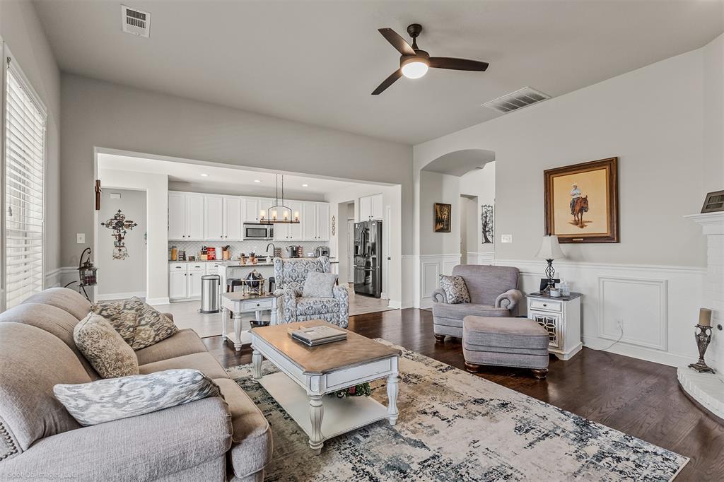 766 Sycamore Trail Forney, TX 75126 - Photo 13 of 37 a living room with furniture and a rug