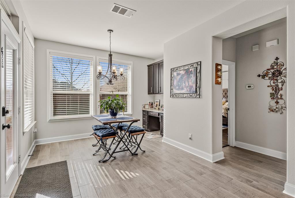 766 Sycamore Trail Forney, TX 75126 - Photo 15 of 37 a view of a livingroom with furniture window and wooden floor