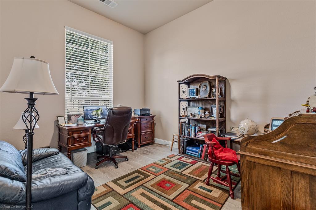 766 Sycamore Trail Forney, TX 75126 - Photo 20 of 37 a living room with furniture a piano and a window