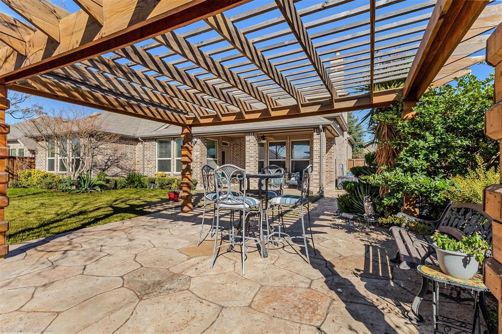 766 Sycamore Trail Forney, TX 75126 - Photo 2 of 37 a view of a patio with table and chairs and potted plants