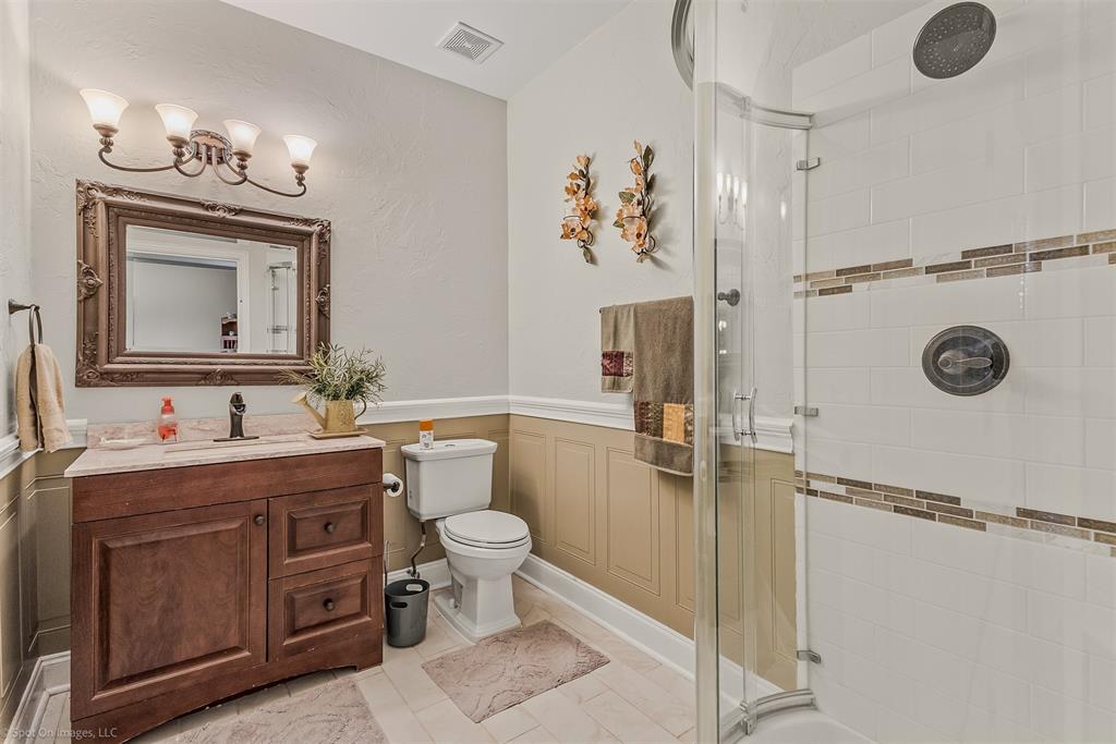 766 Sycamore Trail Forney, TX 75126 - Photo 21 of 37 a bathroom with a toilet sink vanity granite and mirror