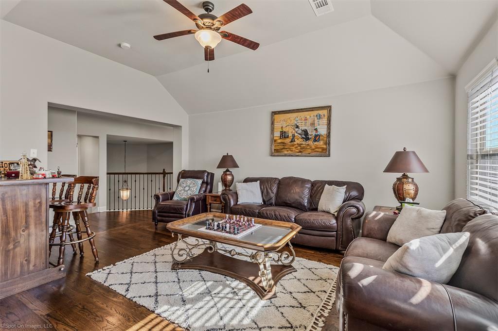 766 Sycamore Trail Forney, TX 75126 - Photo 23 of 37 a living room with furniture a ceiling fan and a window