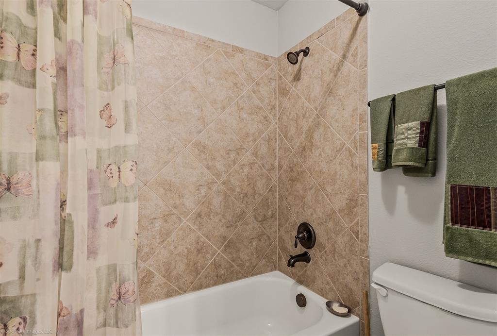 766 Sycamore Trail Forney, TX 75126 - Photo 27 of 37 a bathroom with a bathtub and a shower