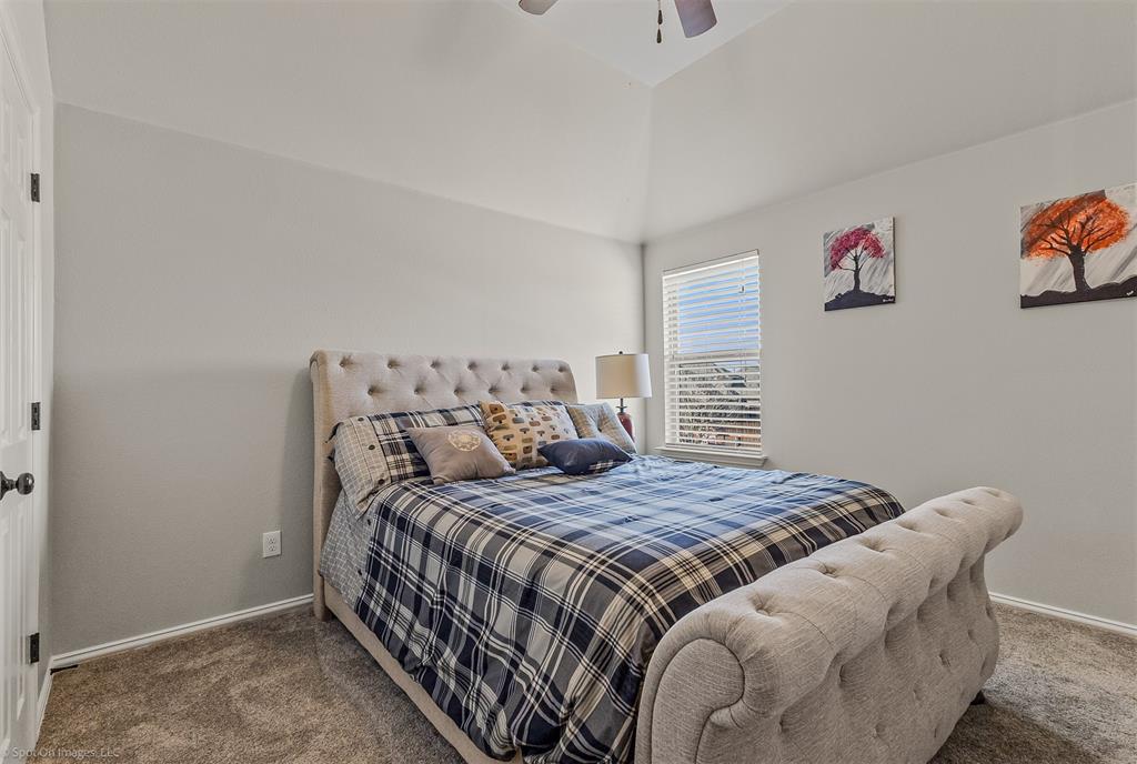 766 Sycamore Trail Forney, TX 75126 - Photo 28 of 37 a bedroom with a bed and cabinets