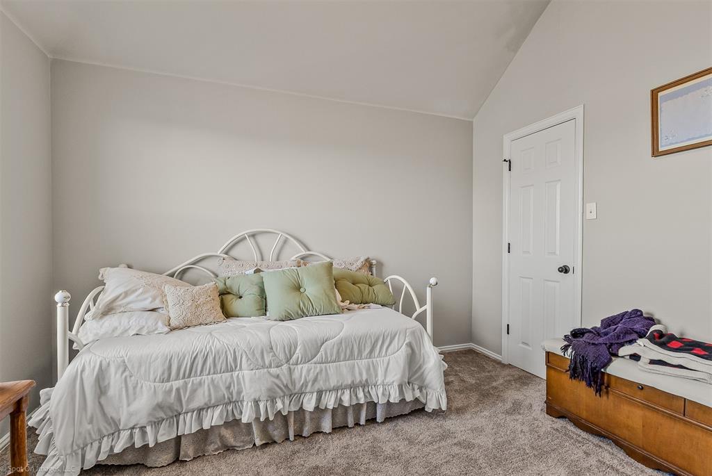 766 Sycamore Trail Forney, TX 75126 - Photo 31 of 37 a bedroom with a bed and a couch