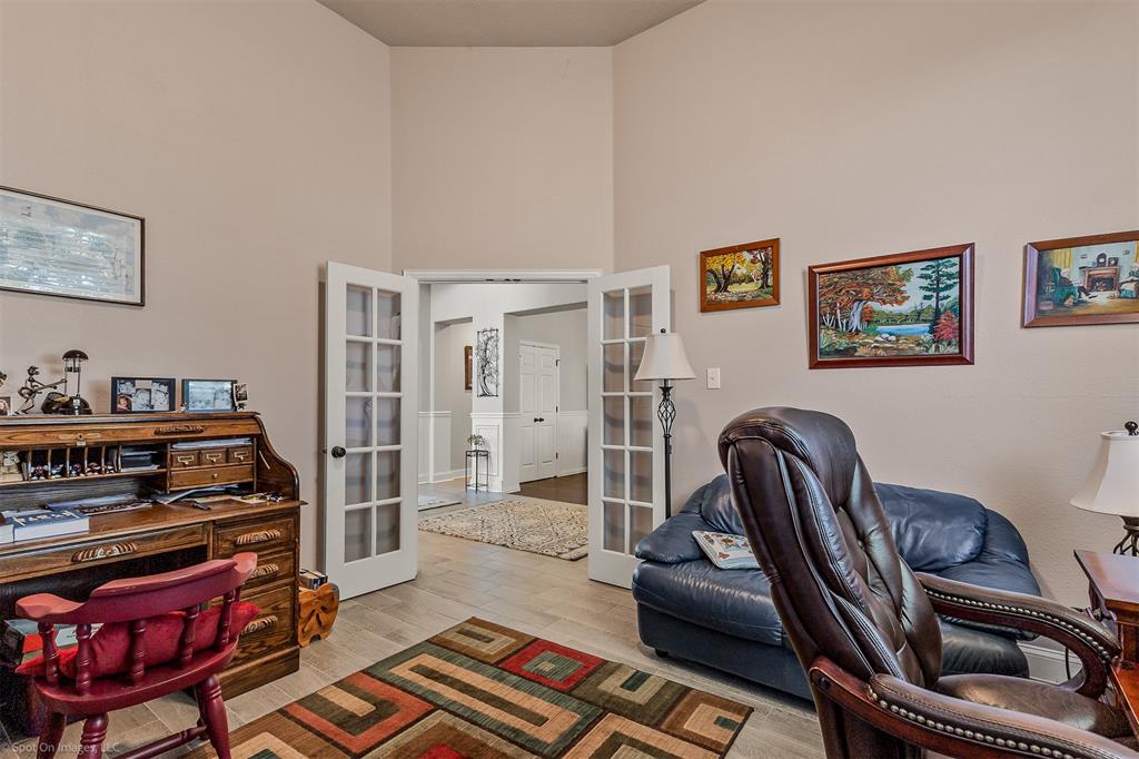 766 Sycamore Trail Forney, TX 75126 - Photo 7 of 37 a living room with furniture and a chair