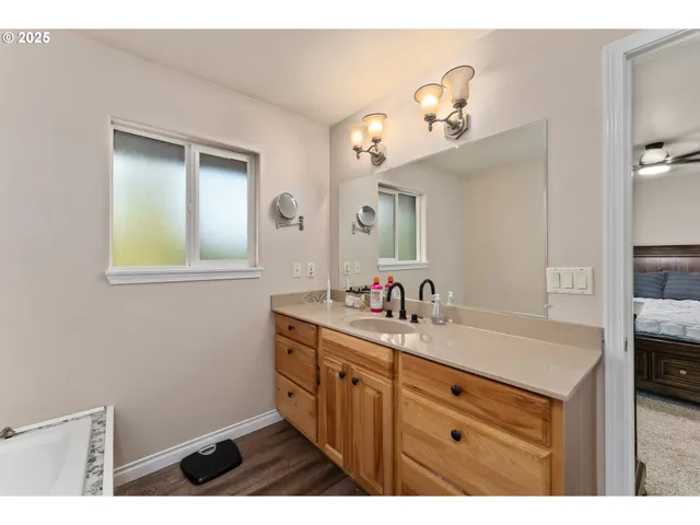 a bathroom with a sink a vanity and a mirror