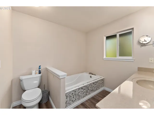 a bathroom with a toilet and a sink