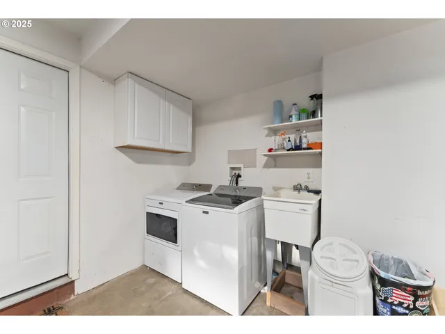 a kitchen with a stove a sink and a refrigerator