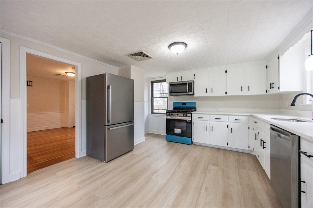 57 Pine Street Milford, MA 01757 - Photo 15 of 29 a kitchen with stainless steel appliances a refrigerator sink and cabinets