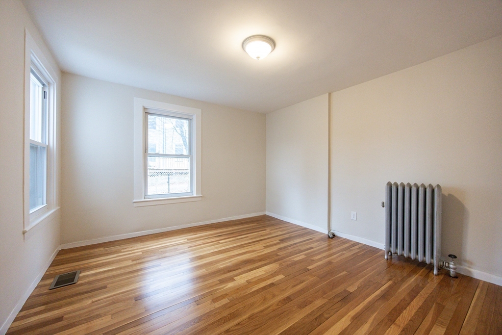 57 Pine Street Milford, MA 01757 - Photo 18 of 29 a view of a room with wooden floor and window