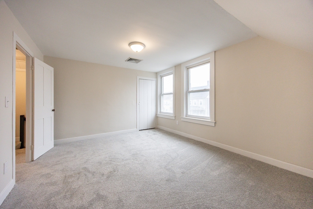 57 Pine Street Milford, MA 01757 - Photo 20 of 29 an empty room with windows