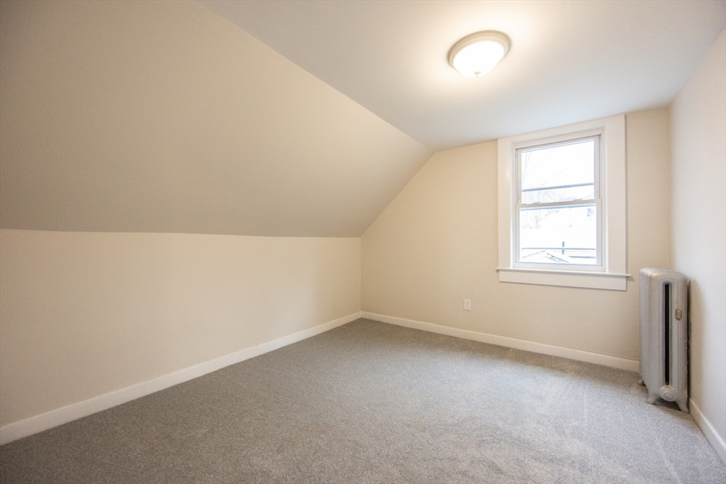57 Pine Street Milford, MA 01757 - Photo 22 of 29 an empty room with a window