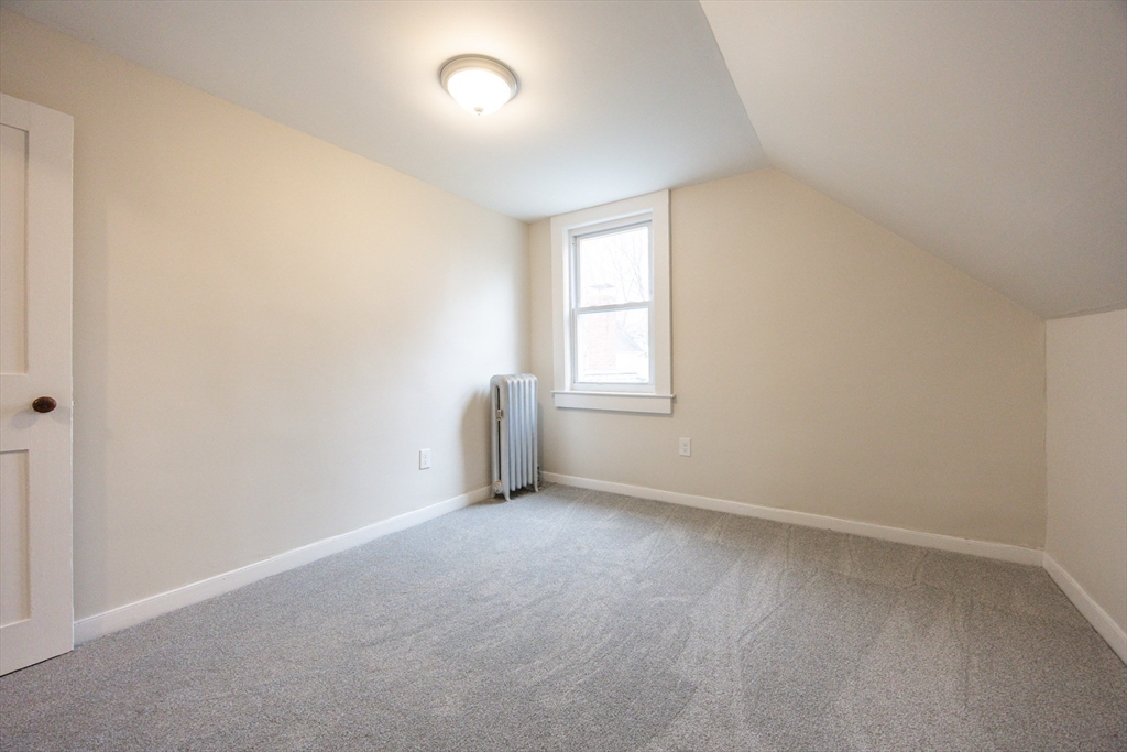 57 Pine Street Milford, MA 01757 - Photo 23 of 29 an empty room with windows