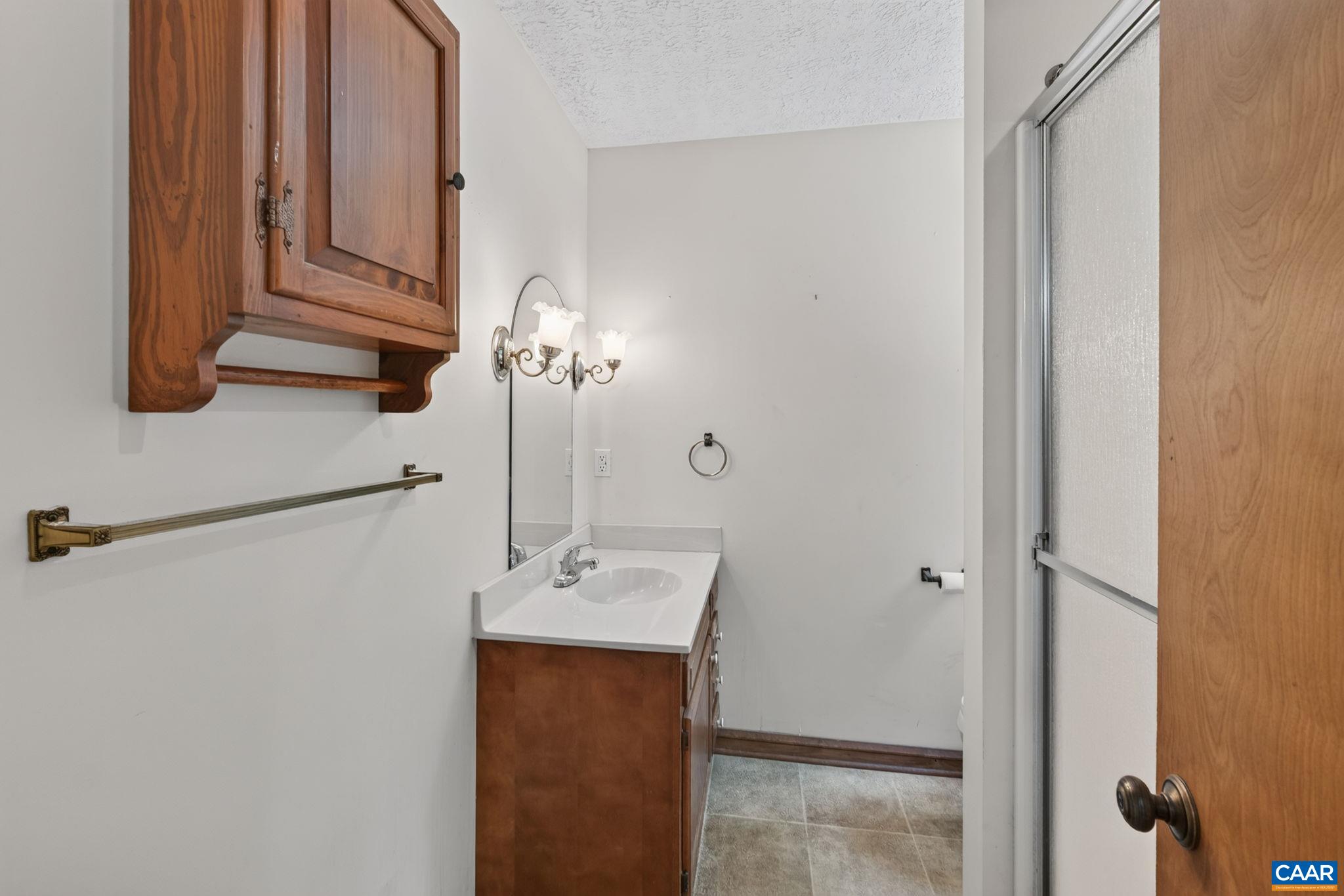 9 Timberlake Terrace Palmyra, VA 22963 - Photo 20 of 35 a bathroom with a sink and mirror