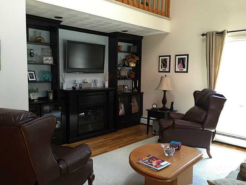3 Justin Street Warren, RI 02885 - Photo 3 of 7 Living Room. Spacious vaulted living room has loads of natural sunlight & opens to dining room & deck area.