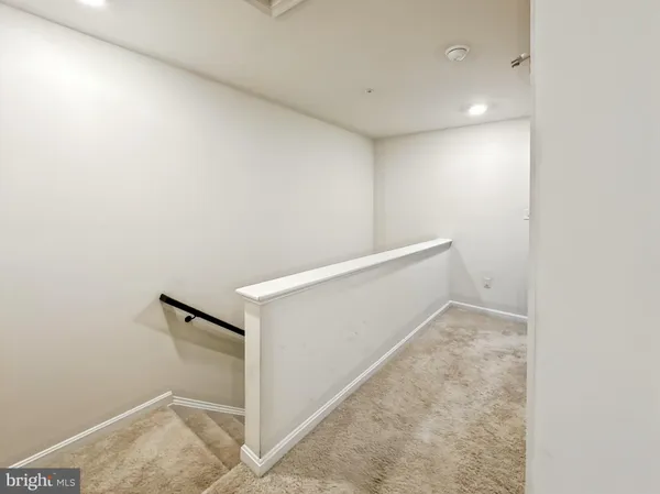a spacious bedroom with a bed and a cabinets
