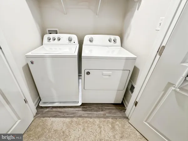 a bathroom with a sink a toilet and shower curtain