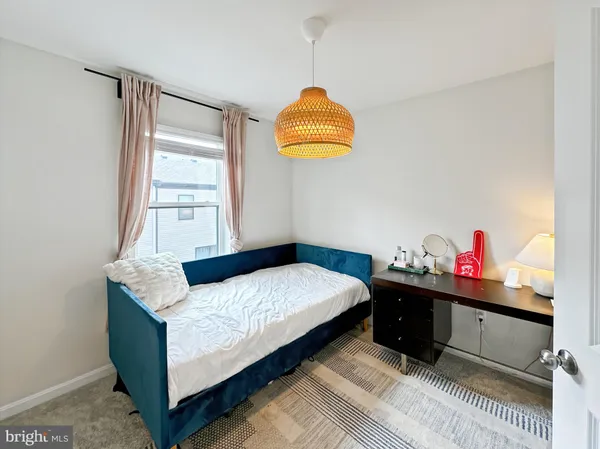 a bed room with furniture and a window