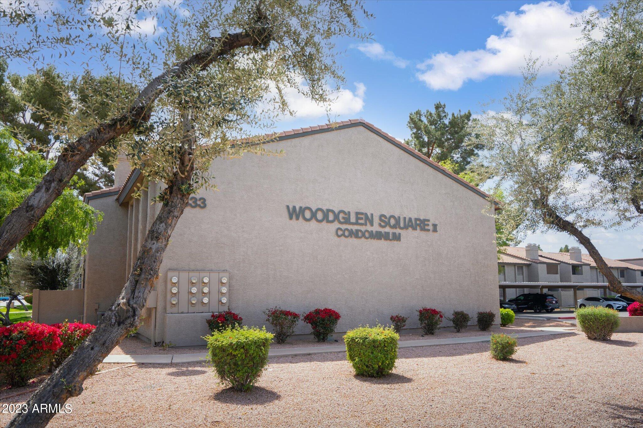 533 West Guadalupe Road, Unit 1024 Mesa, AZ 85210 - Photo 55 of 60 a view of a street with potted plants and a large tree