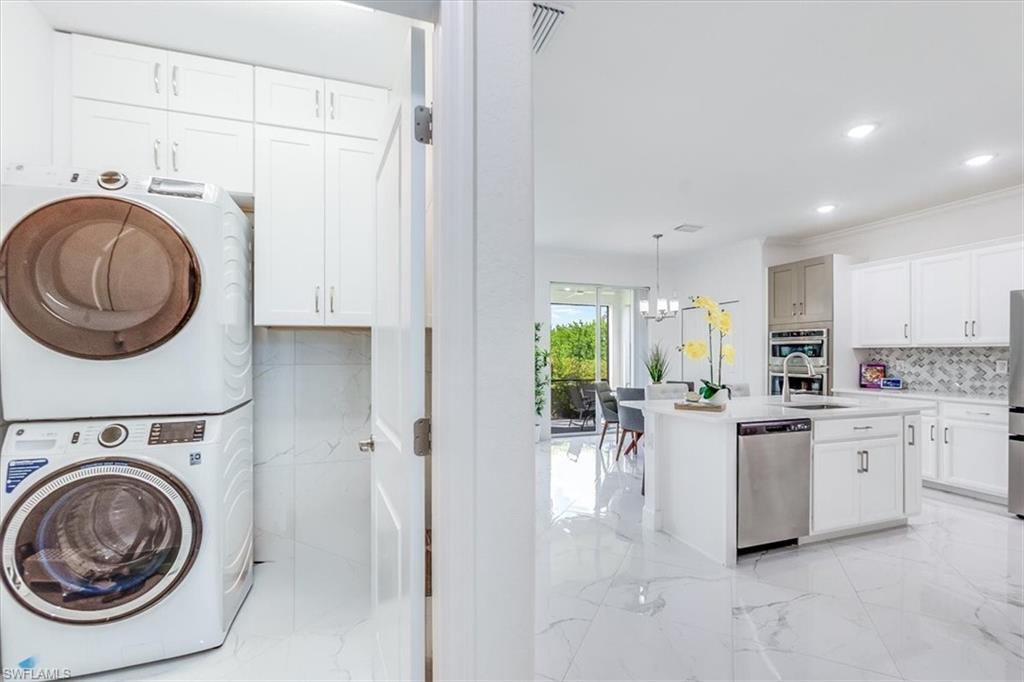 2172 Cara Cara Way Naples, FL 34120 - Photo 39 of 50 Laundry with custom cabinets