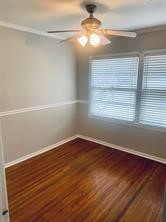 910 Magnolia Street Lake Jackson, TX 77566 - Photo 9 of 12 wooden floor in an empty room with a window