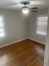 910 Magnolia Street Lake Jackson, TX 77566 - Photo 10 of 12 a view of empty room with wooden floor and fan