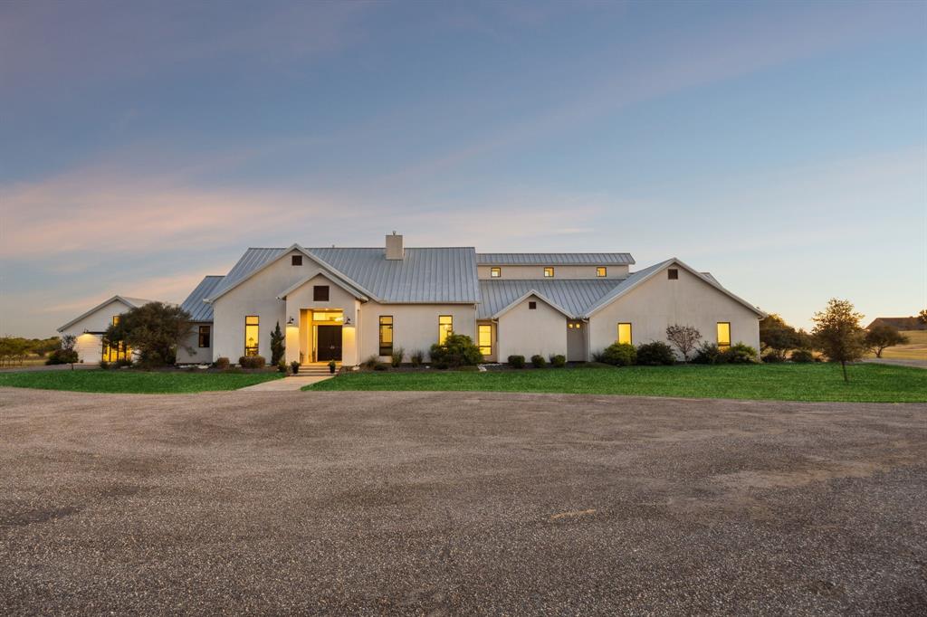 218 Bingham Road Northlake, TX 76226 - Photo 1 of 1 a front view of a house with a yard and garage