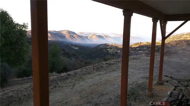 a view of a yard with a mountain