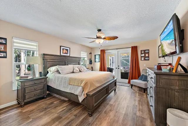 a large white kitchen with cabinets