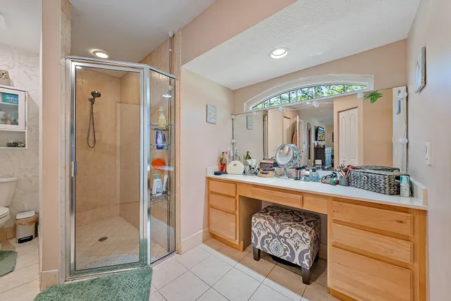 a view of walk in closet with clothes