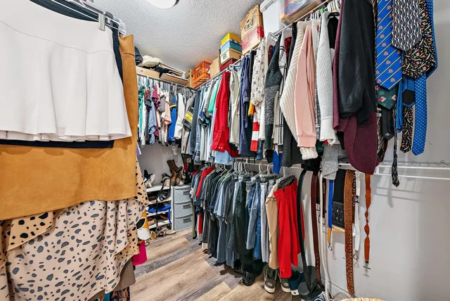a bedroom with a bed and dresser