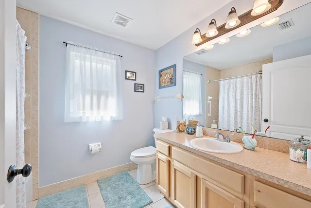 a bathroom with a sink double vanity and a mirror