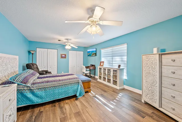 a utility room with cabinets washer and dryer