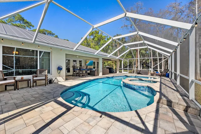a view of a swimming pool with a patio