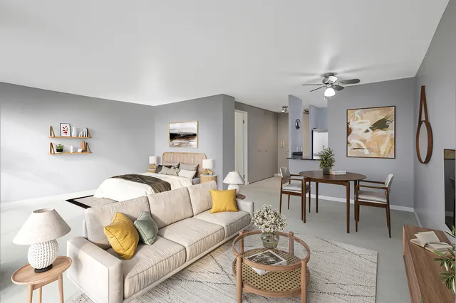 a living room with furniture and a chandelier