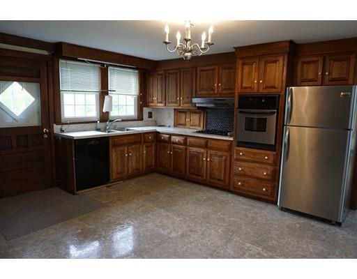 231 Woods Road Barre, MA 01005 - Photo 9 of 30 a kitchen with stainless steel appliances granite countertop a refrigerator a sink a stove a microwave and island