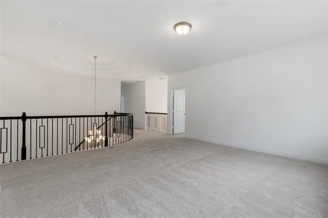 a view of staircase with lots of white walls