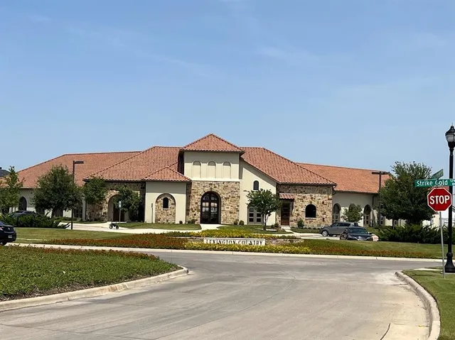 a front view of building with yard