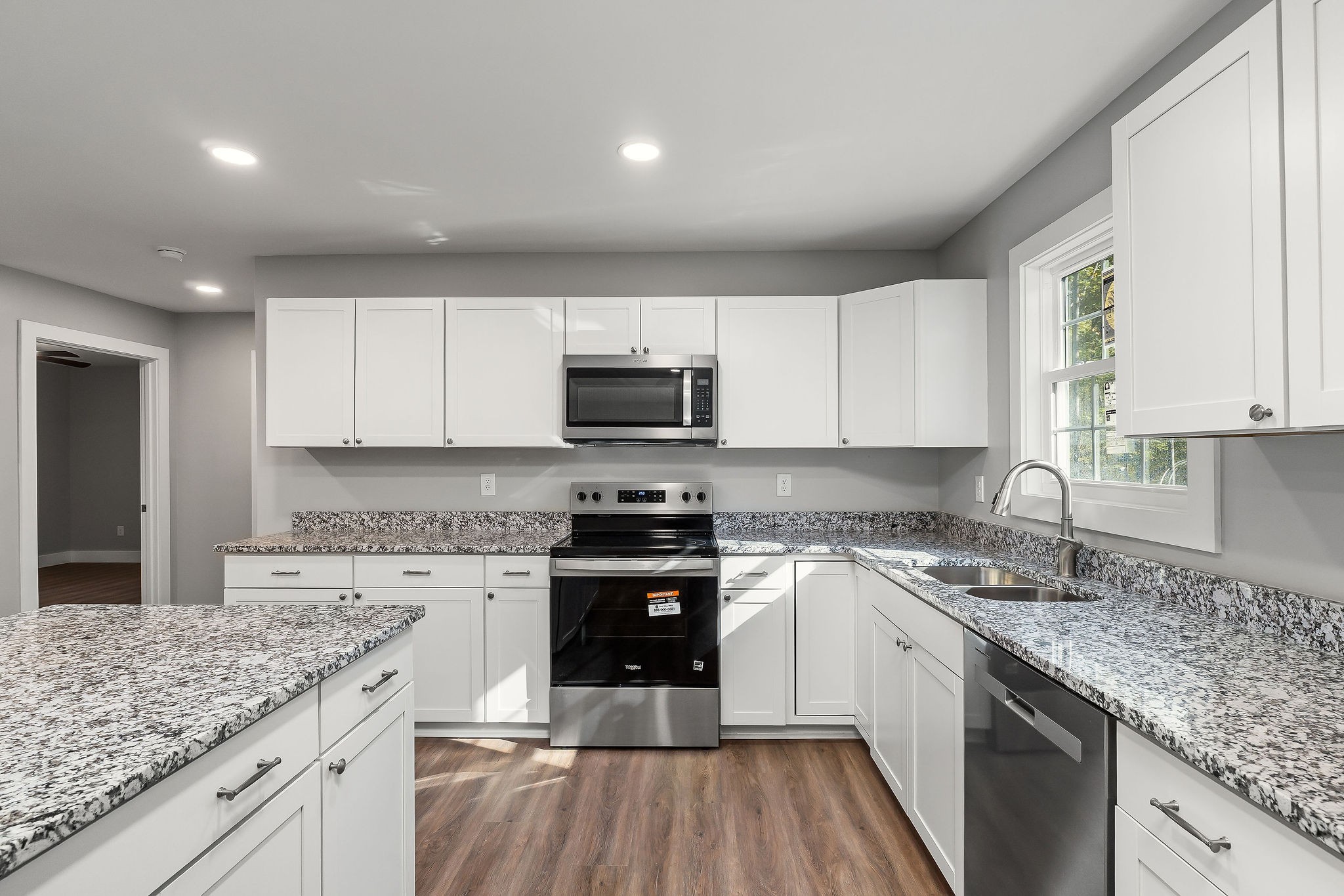 1053 Benton Tidwell Road Hilham, TN 38568 - Photo 9 of 39 a kitchen with a sink stove top oven and cabinets