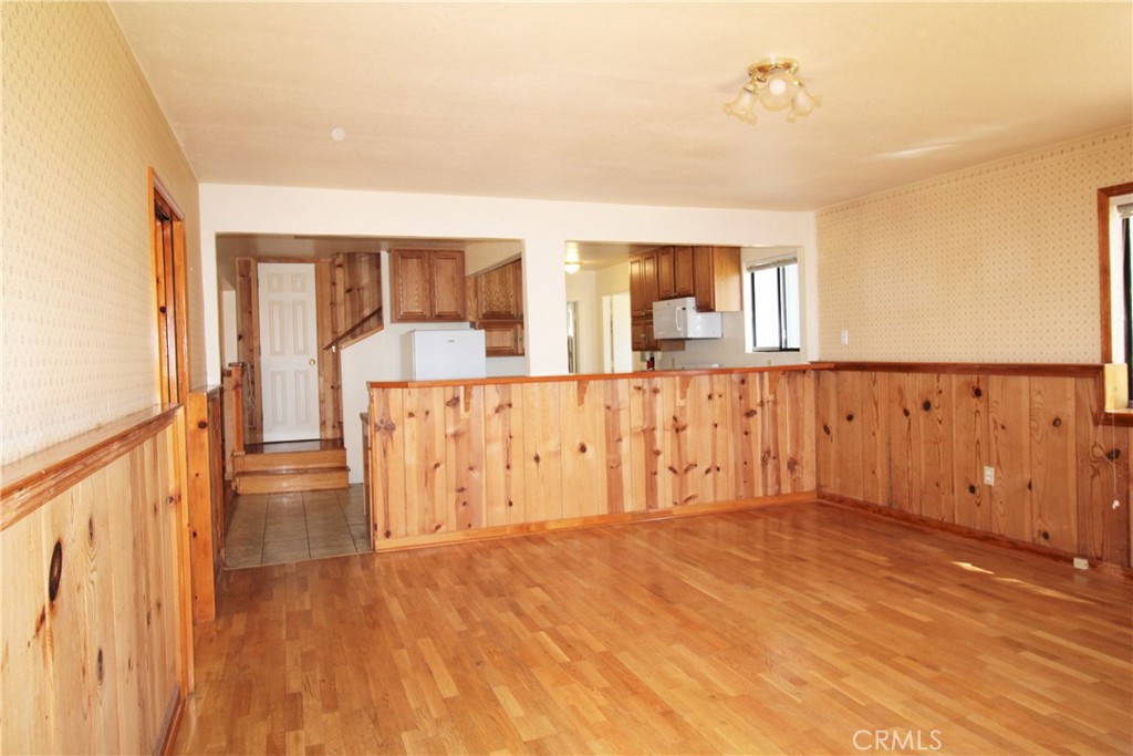 268 Milsap Bar Road Berry Creek, CA 95916 - Photo 10 of 47 a view of an empty room with wooden floor and a window
