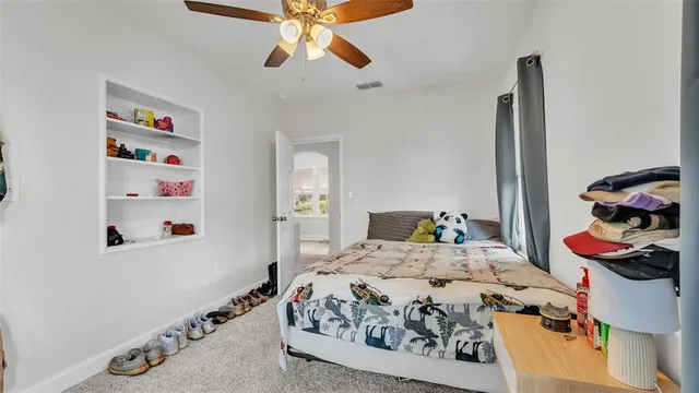 a bedroom with bed and the dresser