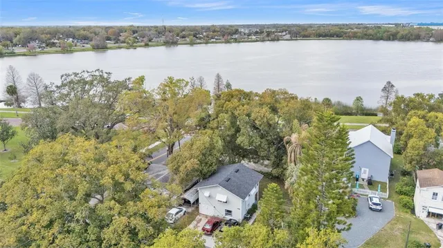 an aerial view of a house with a lake view