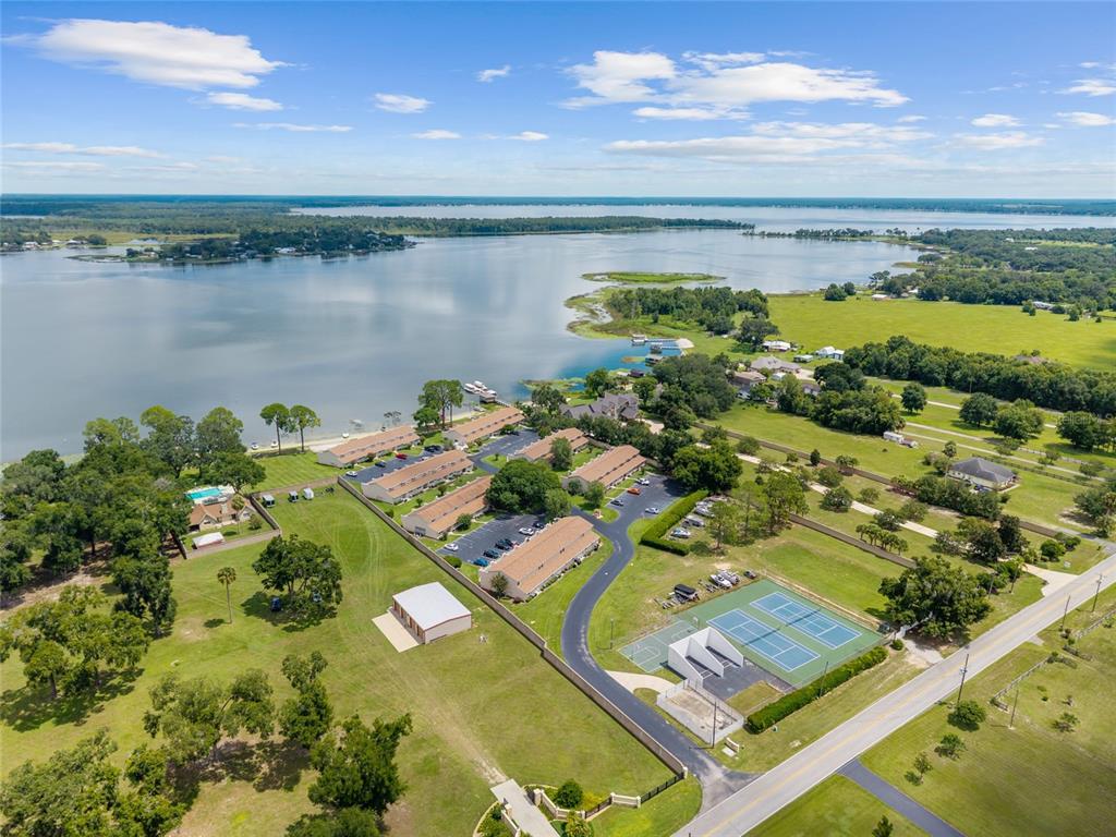 11001 Southeast Sunset Harbor Road, Unit B13 Summerfield, FL 34491 - Photo 1 of 50 a view of a lake